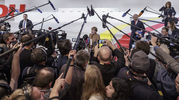 German Chancellor Angela Merkel addresses the media on Thursday.