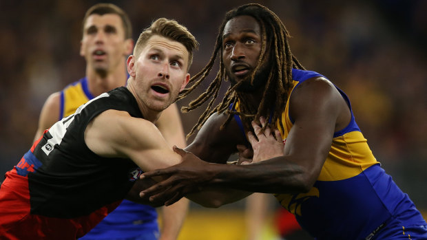 Essendon's Shaun McKernan tussles with Eagle Nic Naitanui. 