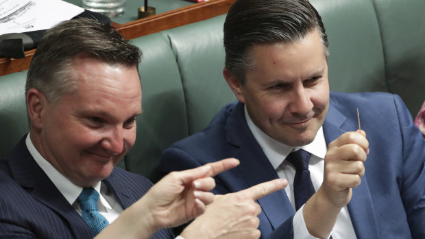 How big is the stick? Labor's energy spokesman (right) holds up a toothpick every time Angus Taylor, his counterpart in government, speaks. Chris Bowen, Labor's treasury spokesman, looks on. 