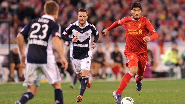 Luis Suarez in action for the Reds at the MCG in 2013.