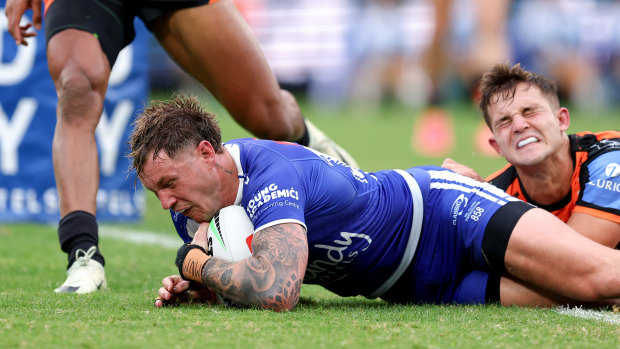 Kurt Mann scores against the Wests Tigers last year.