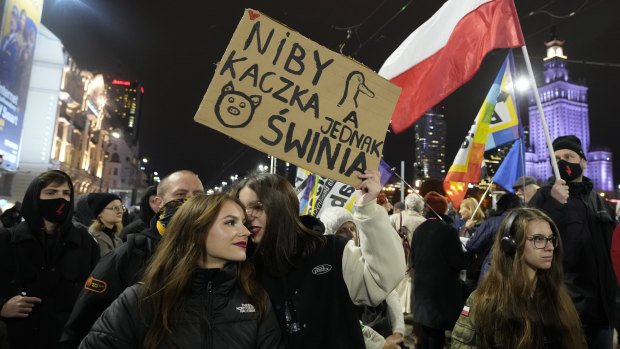 Protesters carry a sign at a protest demanding abortion rights in Warsaw, Poland.