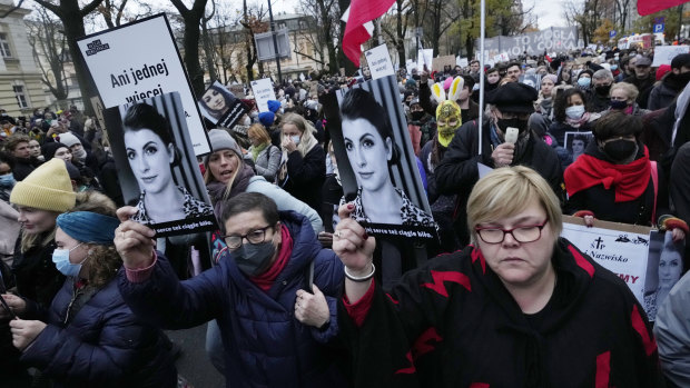 Protesters gather outside Poland’s Constitutional Tribunal in Warsaw to protest against the restrictive abortion laws after a woman died of complications during her pregnancy.