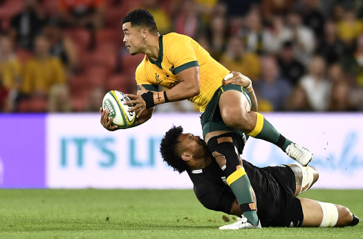 Hunter Paisami of the Wallabies is tackled during the 2020 Tri-Nations match between the Australian Wallabies and the New Zealand All Blacks at Suncorp Stadium.