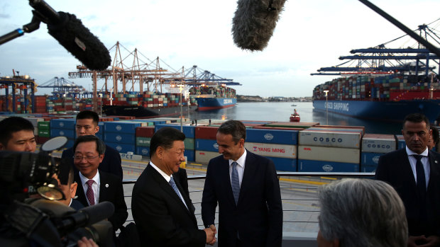 Xi Jinping and Kyriakos Mitsotakis visit the COSCO container terminal at Piraeus port in Athens. 