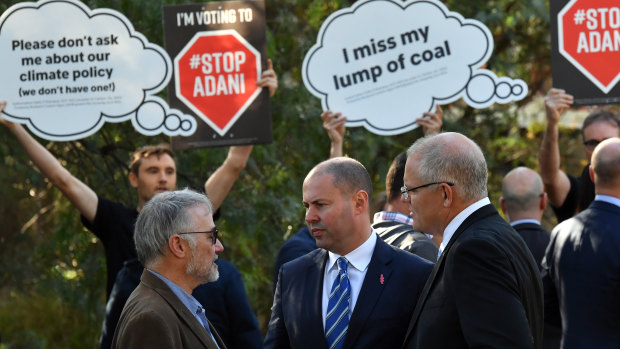 Prime Minister Scott Morrison Treasurer and Josh Frydenberg with anti-Adani protesters in Melbourne.