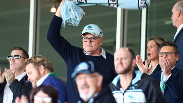 Prime Minister Scott Morrision cheers on the Cronulla Sharks on Saturday.