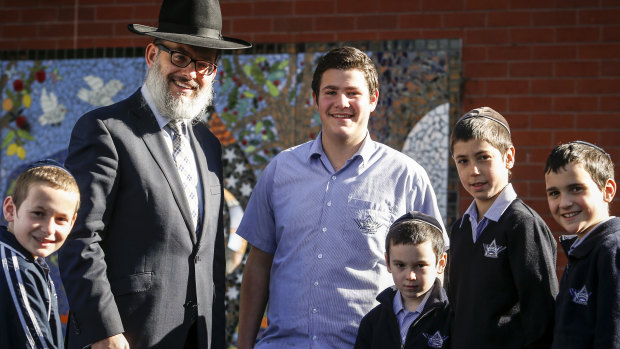 Yeshivah principal Rabbi Yehoshua Smukler with some students in 2015.