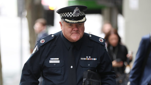 Assistant Commissioner Luke Cornelius arrives at the royal commission. 