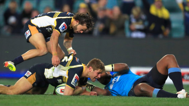 Long night at the office: Kyle Godwin scores for the Brumbies at Allianz Stadium.