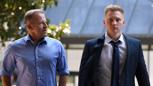 Sam Oliver with his father Chris outside a Sydney court last year.