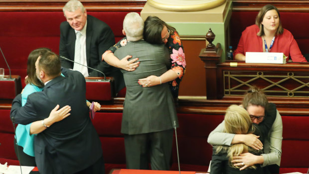 Victorian MPs embrace after the Voluntary Assisted Dying Bill passed the upper house. 