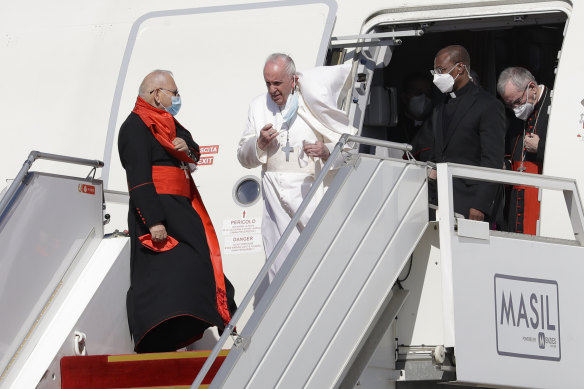 Pope Francis arrives at Baghdad International Airport in Iraq on Friday.