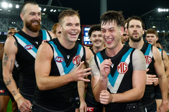 Dan Houston (left) celebrates a Port win with Zak Butters this season.