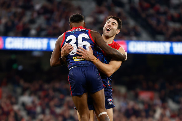 Kysaiah Pickett and Christian Petracca of the Dees celebrate a goal.