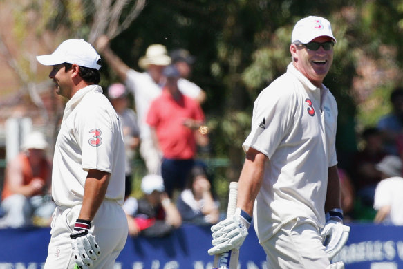 Brad Hodge and Dean Jones share a laugh in a six-a-side match in 2005.