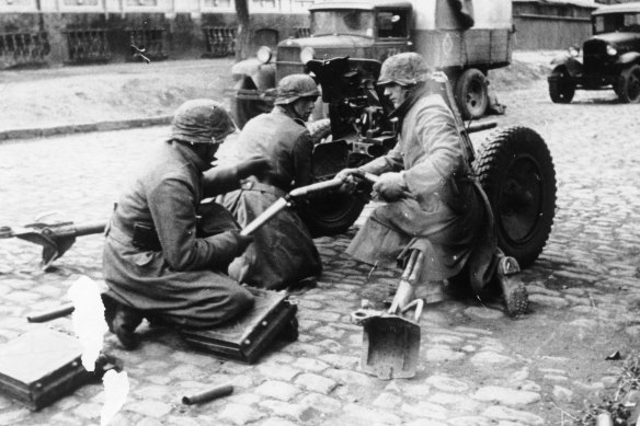Nazi soldiers operate an antitank gun in the streets of Mariupol, in southeastern Ukraine, in October 1941.