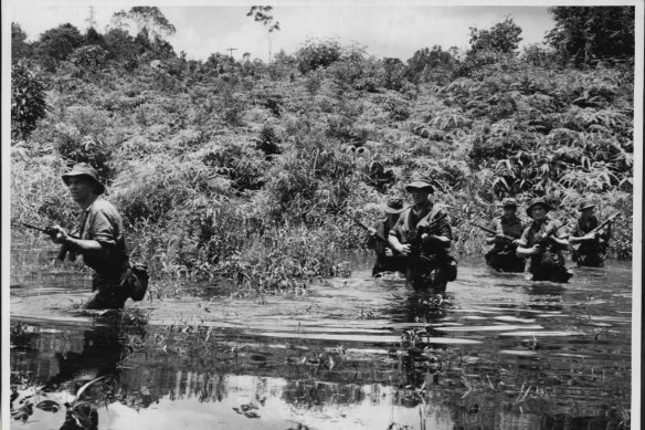 Australian infantrymen of the 1st Battalion, Royal Australian Regiment, newly arrived in Malaya are undergoing rigorous training at Kota Tinggi in South Malaya.