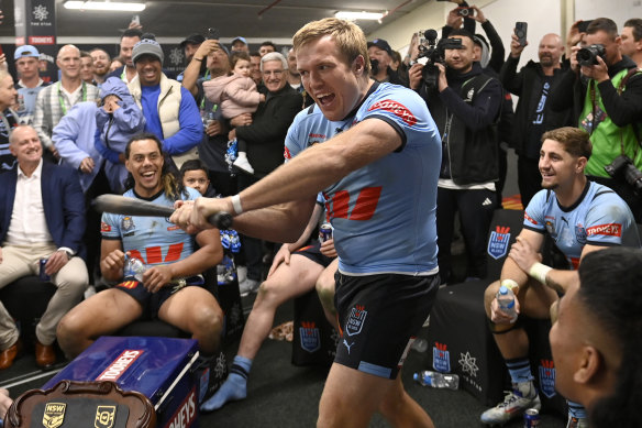 Swing, batter, swing: Blues skipper Jake Trbojevic celebrates with Michael Maguire’s baseball bat.
