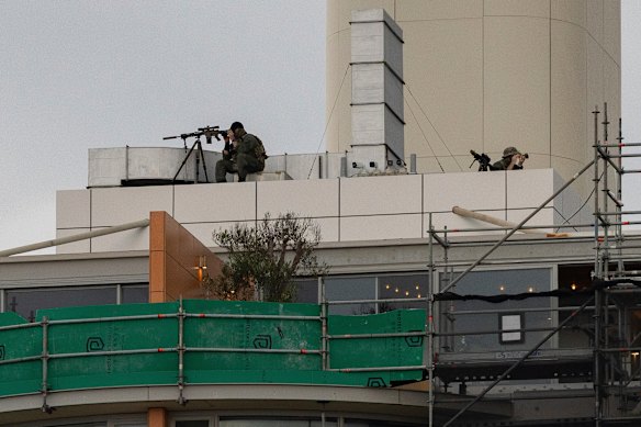 A sniper keeps watch on tonight’s event at Bondi Beach.