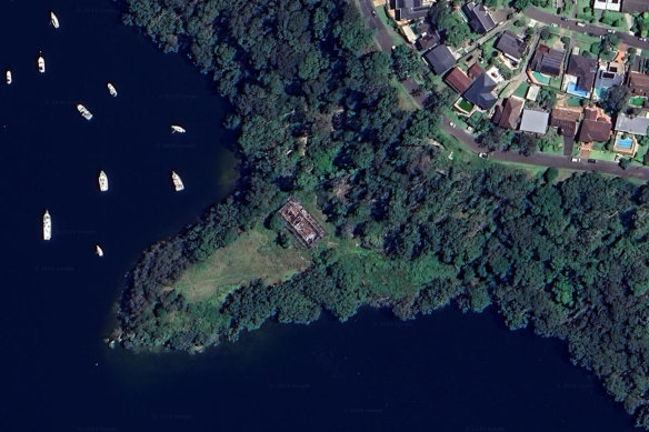 The burnt ruins of 107 Killarney Drive on Killarney Point. The section of the track parallel to the road has been inaccessible for years. 