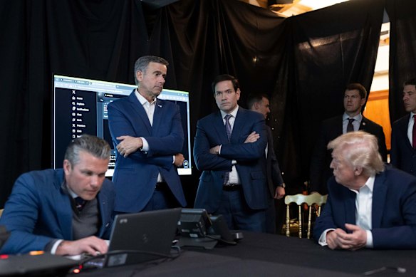 US President Donald Trump talks with CIA Director John Ratcliffe and Secretary of State Marco Rubio as Defence Secretary Pete Hegseth monitors the Venezuelan operation.