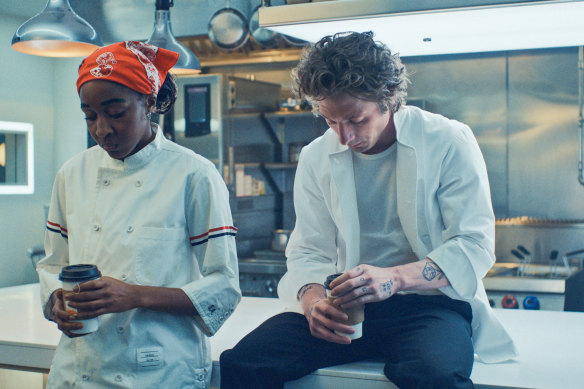 Ayo Edebiri as Sydney and Jeremy Allen White as Carmy in their kitchen in <i>The Bear</i>.