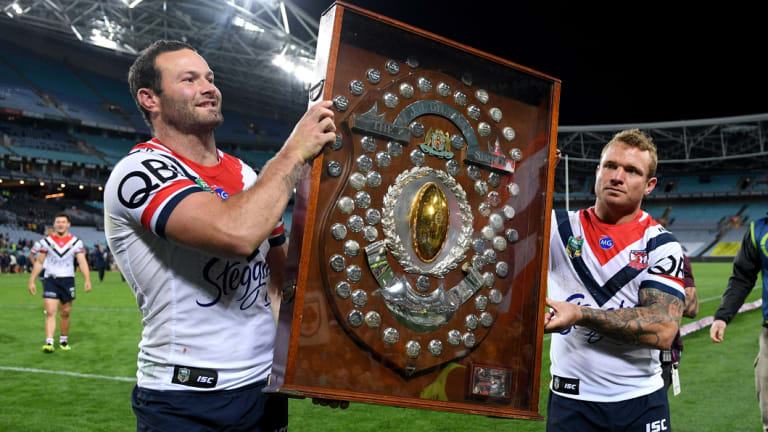 Finishing on top: Boyd Cordner and Jake Friend hold the J.J. Giltinan Shield after claiming the minor premiership.
