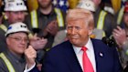 Donald Trump in the White House with coal miners on Tuesday.