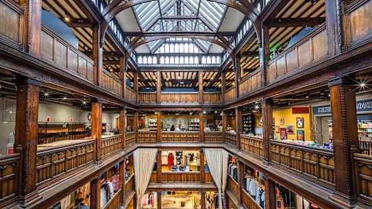 The interior of Liberty, a prestigious London department store housed in a Tudor revival-style building.