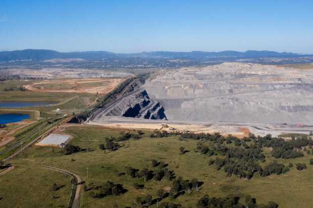 The Mount Pleasant mine, far left, and Bengalla mine, right, with the town of Muswellbrook in the distance.