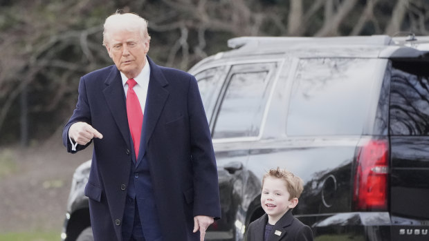 President Donald Trump walks with Elon Musk’s son X Æ A-Xii on the South Lawn of the White House, Friday, March 14, 2025, in Washington to depart on Marine One. (AP Photo/Alex Brandon)
