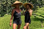 The author (right) with a friend, learning to plant rice in Bali.