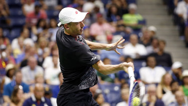 Power and passion: Millman unleashes a forehand in his memorable win.