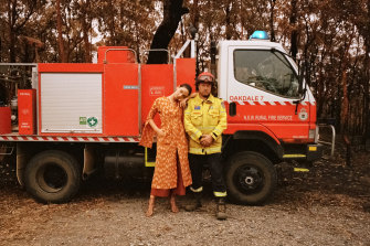 A model poses with Rural Fire Service volunteer Mick as part of a shoot for KITX at Orangeville, NSW.