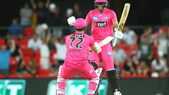 Steve O'Keeffe and Gurinder Sandhu celebrate a Sixers' win.