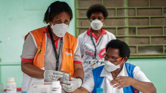 Medical staff in a health clinic in Papua New Guinea, which recorded its eighth COVID-19 case.