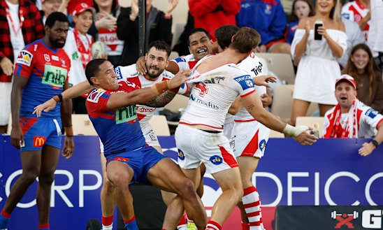 Knights forward Tyson Frizell responds to Dragons centre Zac Lomax.