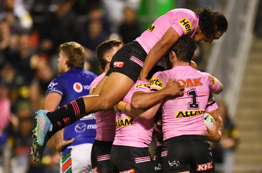 Panthers players celebrate a try.
