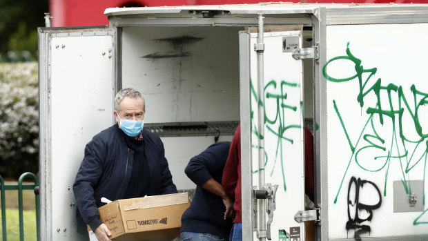 Labor MP Bill Shorten delivers food to the Flemington Towers Government Housing complex.