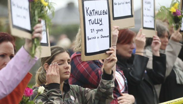 Protesters hold up the names of children at the site of the former Tuam home for unmarried mothers in County Galway on Sunday. The protest was timed to coincide with a visit to Ireland by Pope Francis.
