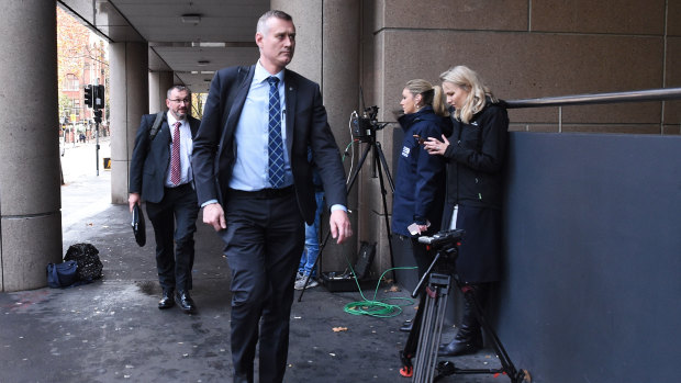 AFP officers arrive at the ABC offices, where they spent the afternoon sifting through thousands of documents related to an ABC investigation.