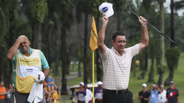 Scott Hend celebrates victory at the Maybank Championship on the first playoff hole.