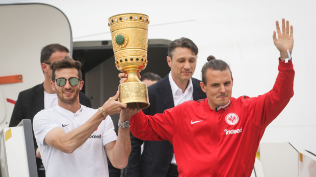 Former Eintracht Frankfurt striker Alex Meier (right) with the Bundesliga's German Cup.