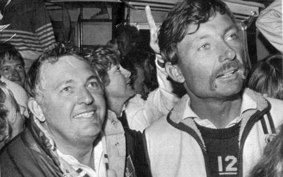 Alan Bond, head of the Australia II syndicate gives the thumbs up as he and skipper, John Bertrand are surrounded by fans following their victory over the America's Cup defender Liberty in 1983.
