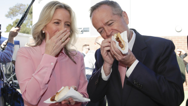 Bill and Chloe Shorten enjoy an election day sausage.