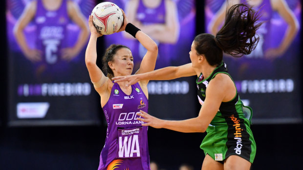Caitlyn Nevins (left) of the Firebirds in action during the round 5 Super Netball match against West Coast Fever at the Brisbane Entertainment Centre on Saturday.