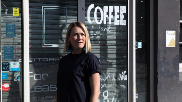 Amelia Birch outside her former business, The Book Kitchen, which closed down because of the light rail construction on Devonshire Street, Surry Hills. 