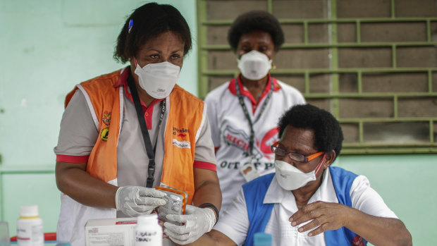 Medical staff in a health clinic in Papua New Guinea, which recorded its eighth COVID-19 case.