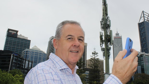 Telstra WA area general manager Boyd Brown testing the 5G signal in Perth.